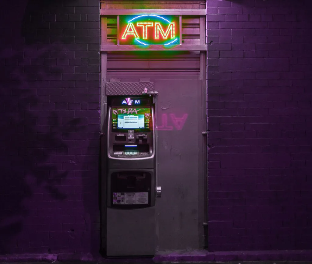 atm on wall at night