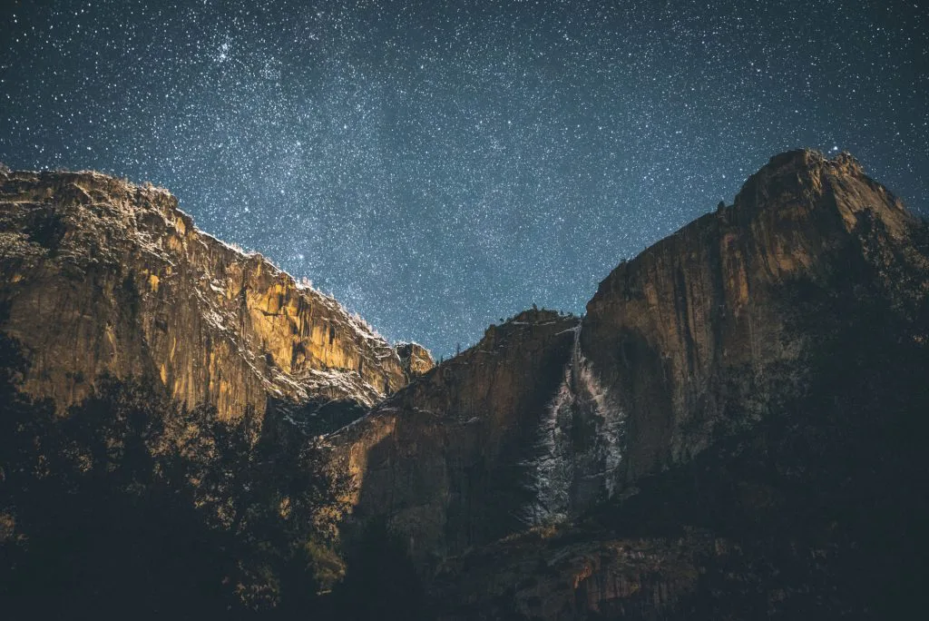 night sky with stars over mountains