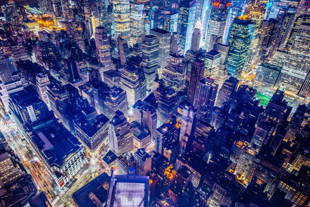 panorama of nyc skyline at night with lots of lights